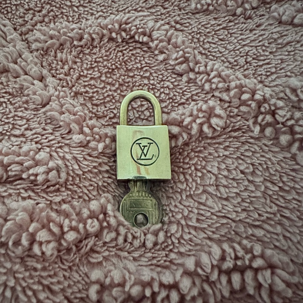 #217 Louis Vuitton Gold Padlock with Key 200 series.